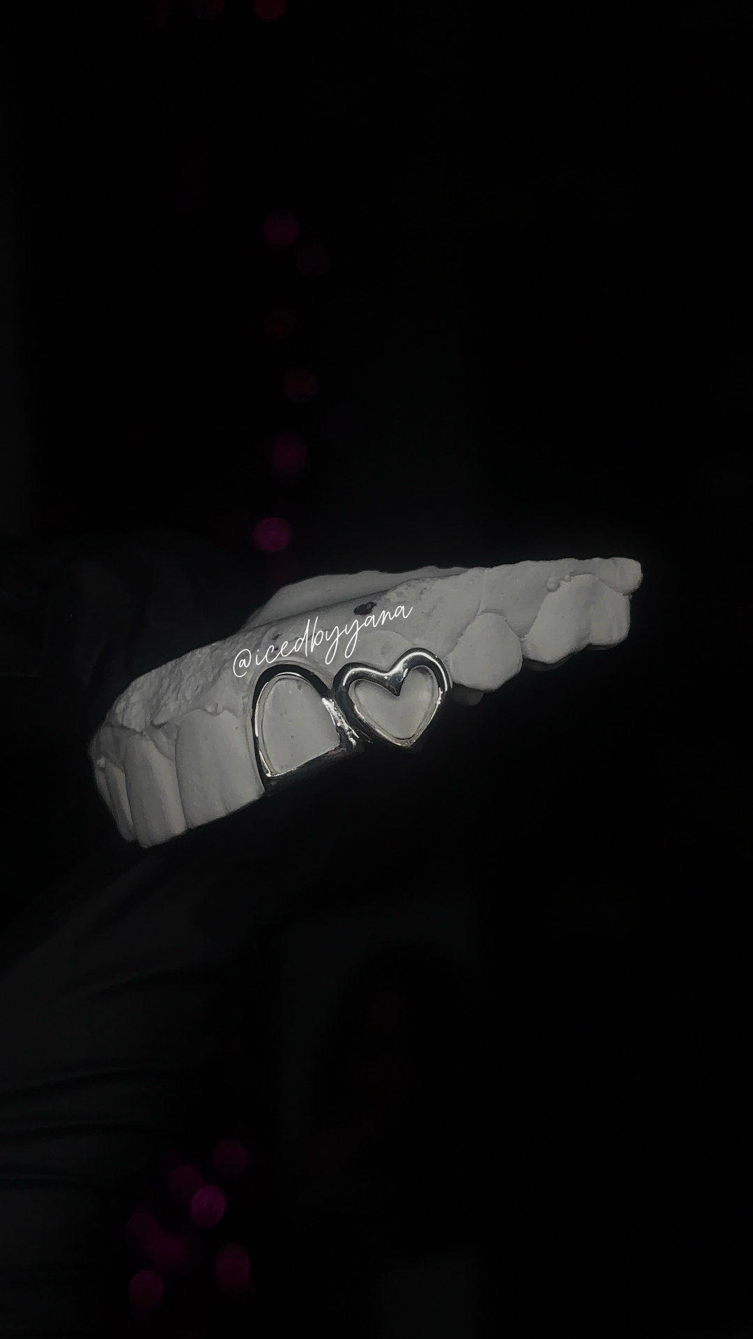 Sterling silver double-heart open-face grill on model