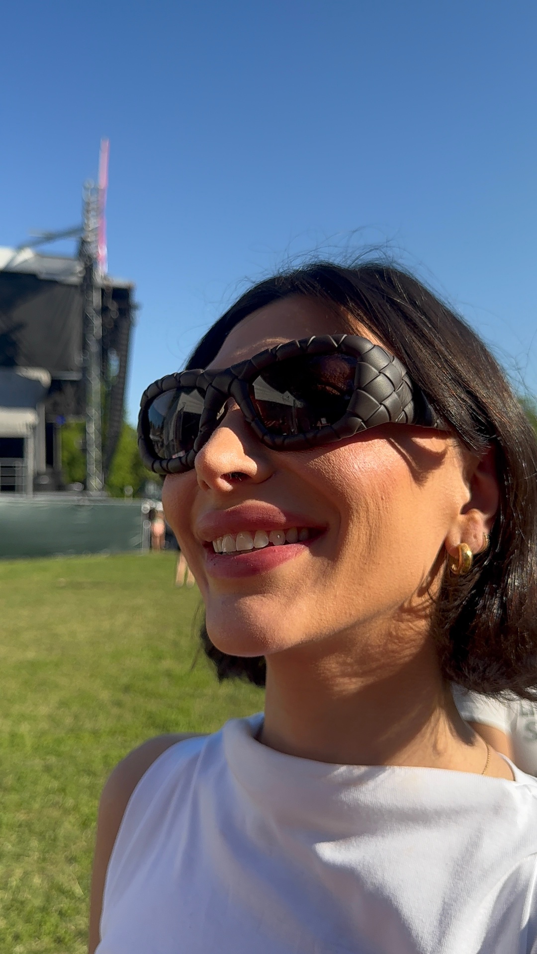 Sunglasses smile showing off a new tooth gem