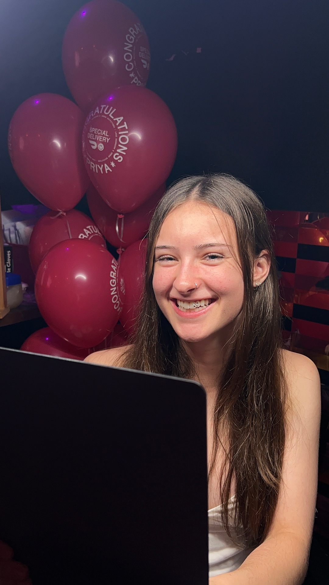Client laughing after a fresh tooth gem application