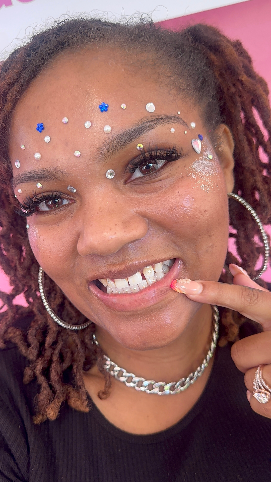 Festival glam smile with face crystals and a tooth gem