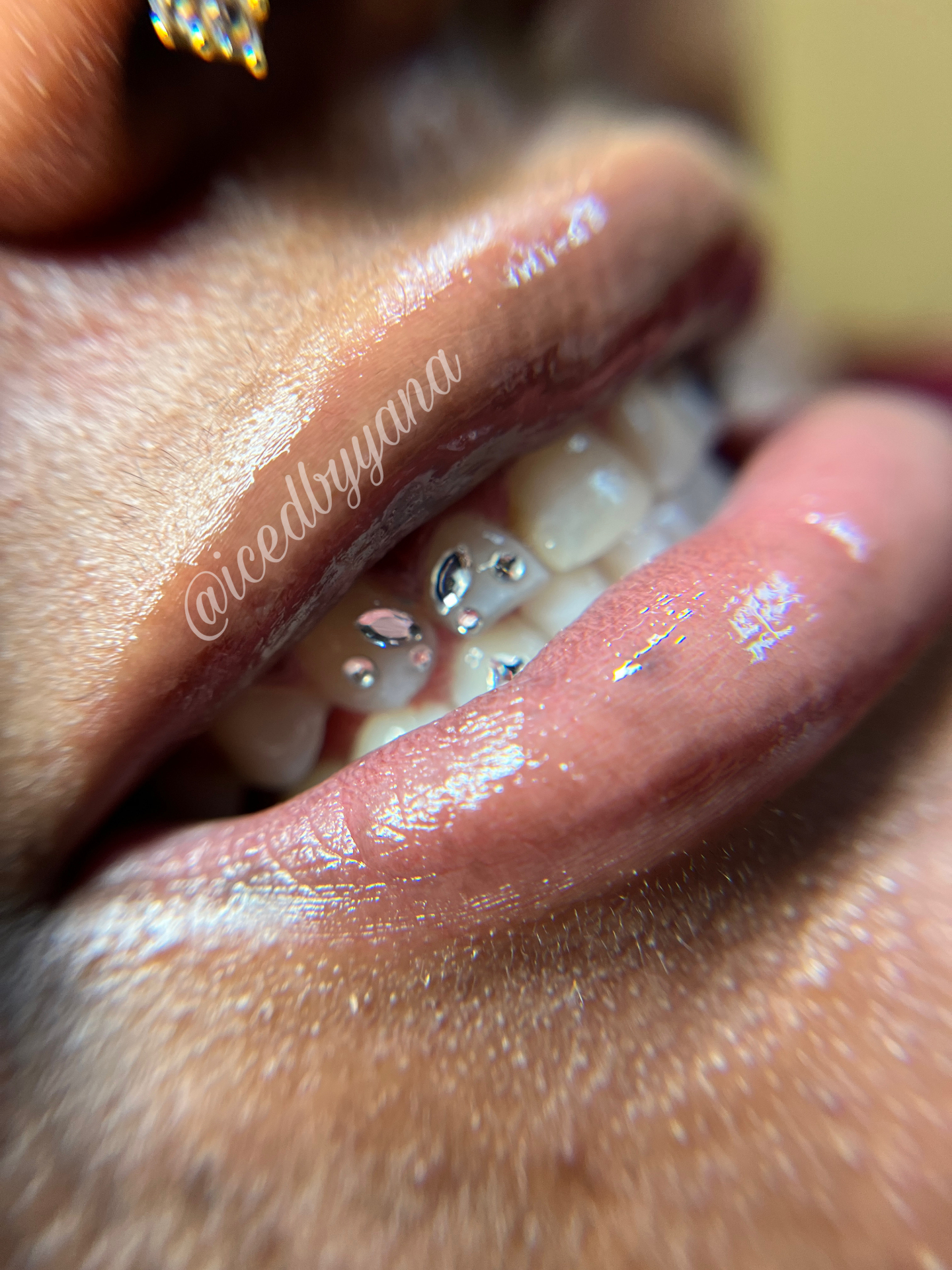 Glossy lip macro with silver tooth gem cluster